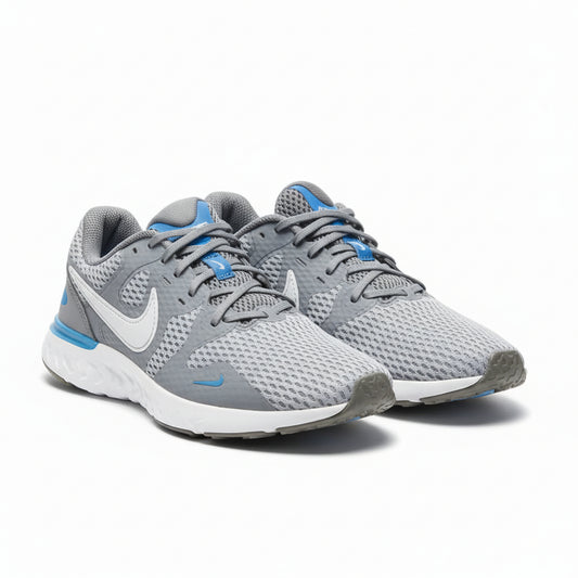 Gray Nike running shoes with blue accents on a white background