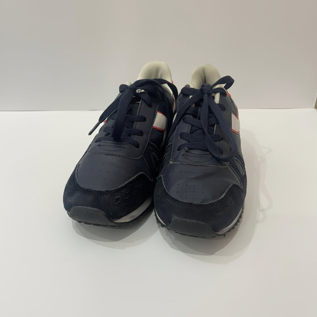 Pair of navy blue sneakers on a white background